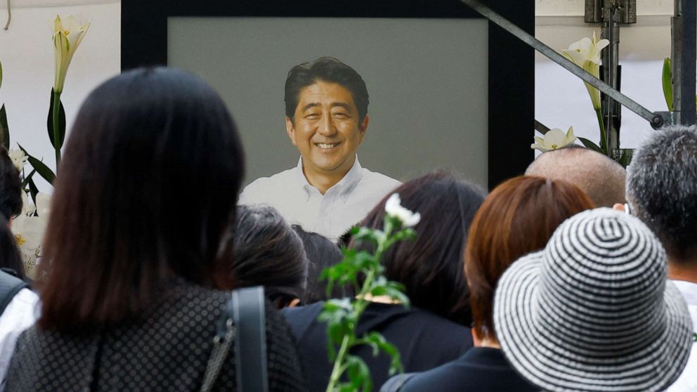 PHOTO: People gather to offer flowers at Zojoji Temple, where the funeral of late former Japanese Prime Minister Shinzo Abe is being held, in Tokyo, Japan July 12, 2022.