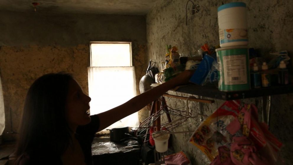 PHOTO: Teacher Vanessa Posada shows her pantry at her home in Venezuela. Due to soaring inflation, she sometimes prefers to get paid in food so she can feed her family.