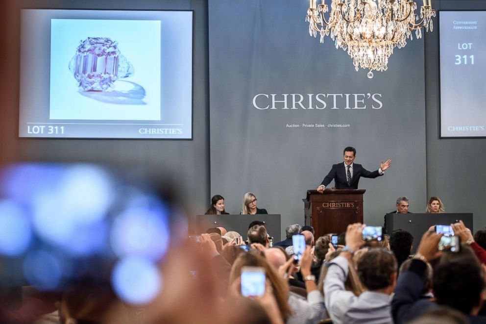 PHOTO: Christie's jewelry department head Rahul Kadakia gestures during the sale of The Pink Legacy, a 18.96 carat fancy vivid pink diamond once owned by the Oppenheimer family, Nov. 13, 2018, in Geneva, Switzerland.