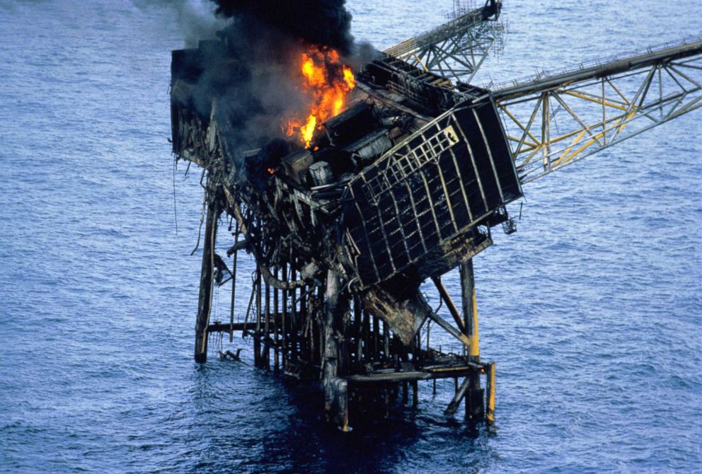 PHOTO: The wreckage of the Piper Alpha oil production platform still burns in the North Sea, off Aberdeen, July 7, 1988.