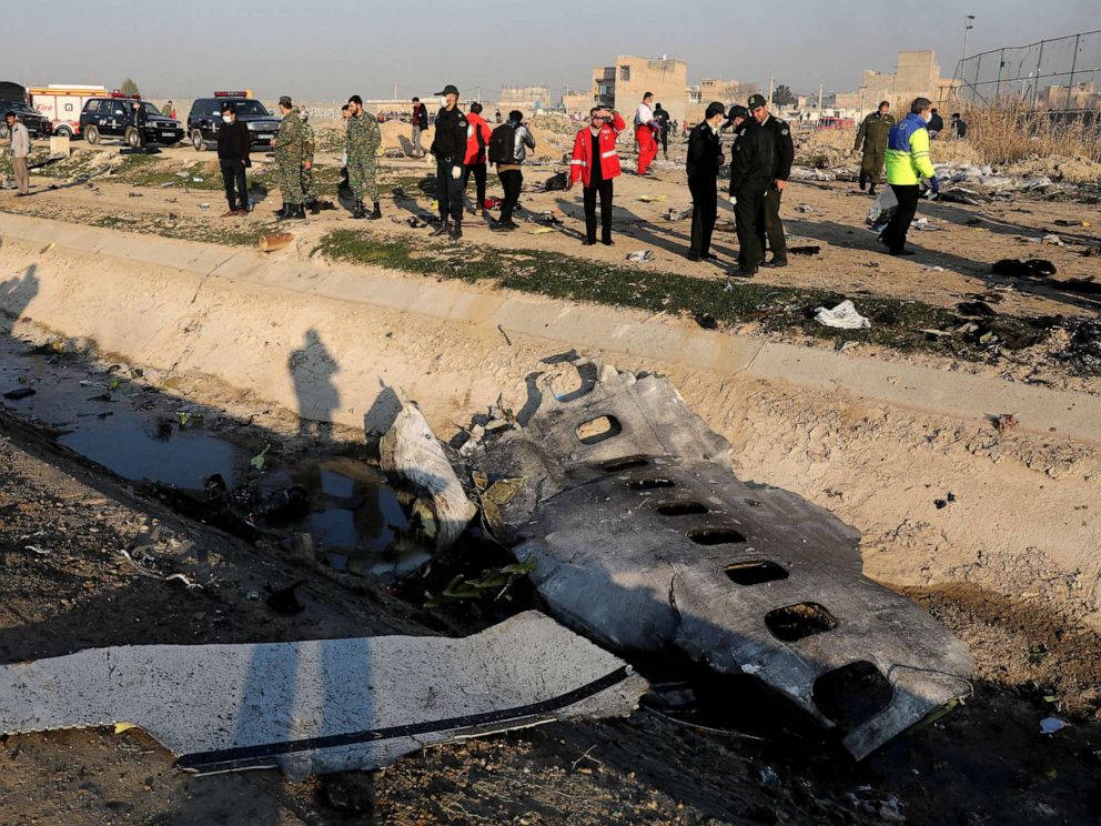 PHOTO: Debris is seen from an Ukrainian plane which crashed as authorities work at the scene in Shahedshahr, southwest of the capital Tehran, Iran, Jan. 8, 2020.
