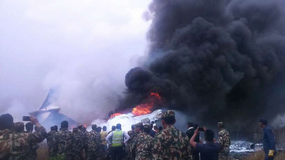 PHOTO: Authorities have rescued at least 17 passengers on a flight that landed in Nepal, skipped off the runway and burst into flames, March 12, 2018.