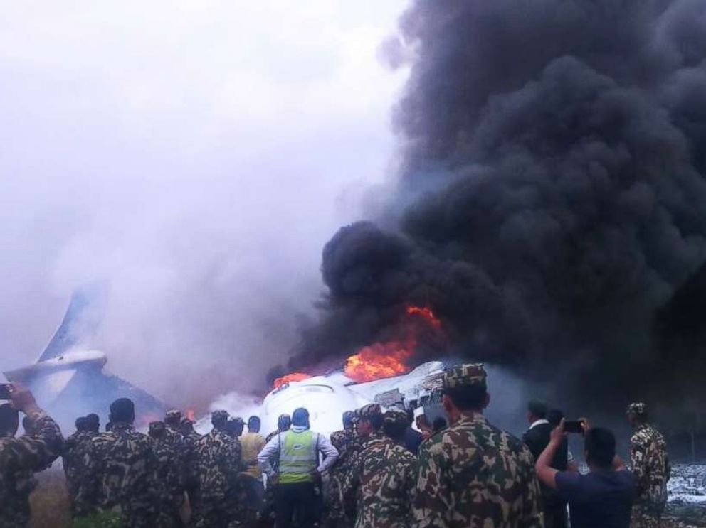 PHOTO: Authorities have rescued at least 17 passengers on a flight that landed in Nepal, skipped off the runway and burst into flames, March 12, 2018.