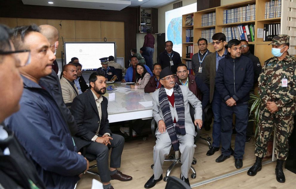 PHOTO: Nepal's Prime Minister Pushpa Kamal Dahal watches a live television broadcast after an aircraft crashed in Pokhara in western Nepal, Jan. 15, 2023.
