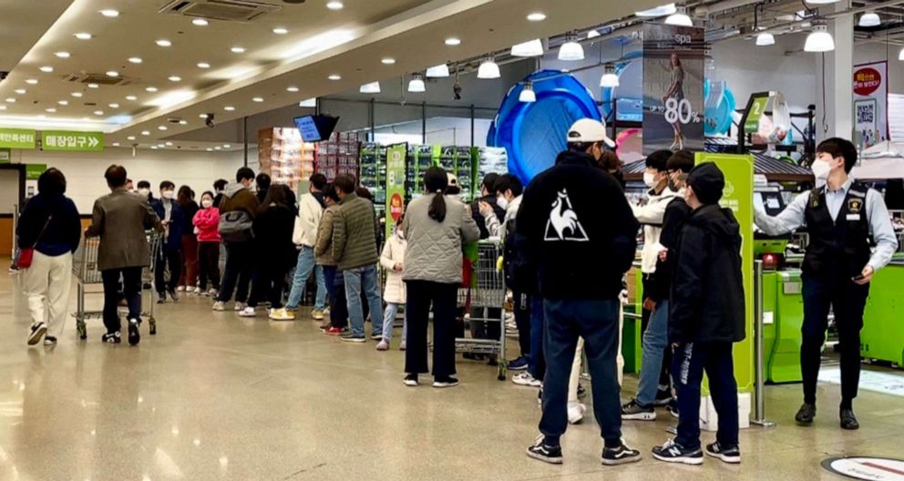 PHOTO: People lined up to buy Pokemon bread on a Sunday morning before a wholesale mart opening hours, Yongin, South Korea, April 9, 2022.