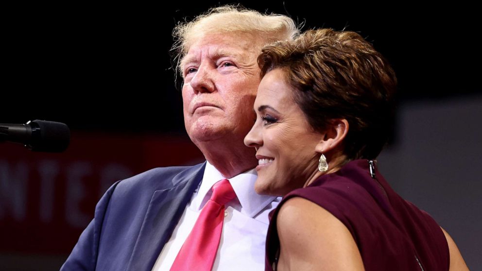 PHOTO: Former President Donald Trump embraces Republican candidate for governor Kari Lake at a "Save America" rally in support of GOP candidates in Prescott Valley, Ariz., July 22, 2022. 