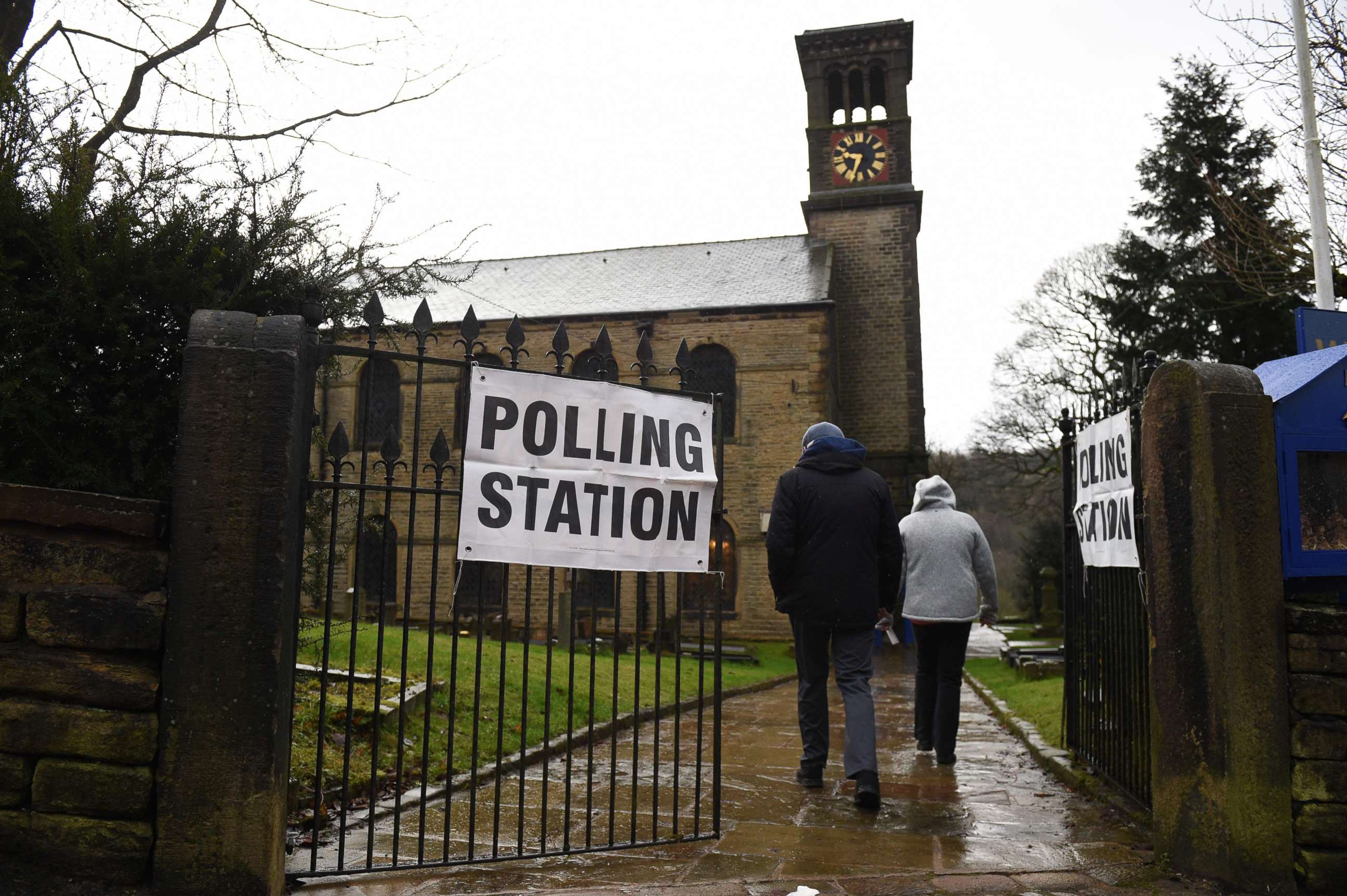 PHOTO: Residents arrive to vote at a polling station in Dobcross, northwest England, as Britain holds a general election on Dec. 12, 2019.