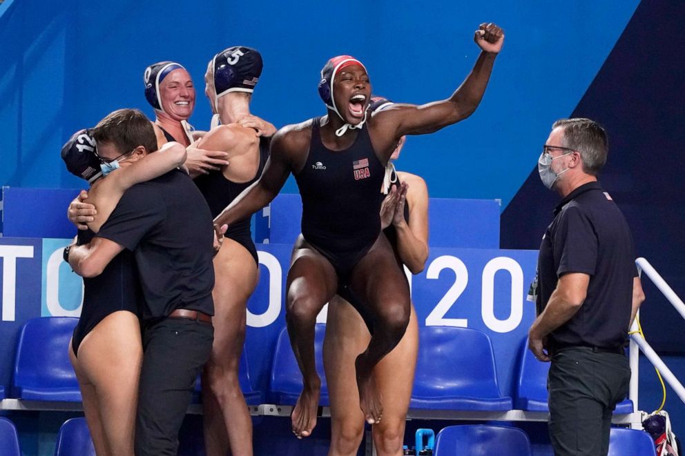 PHOTO: United States' goalkeeper Ashleigh Johnson, center, leaps as players celebrate as time expires in the women's water polo gold medal match against Spain at the 2020 Summer Olympics, Aug. 7, 2021, in Tokyo, Japan.