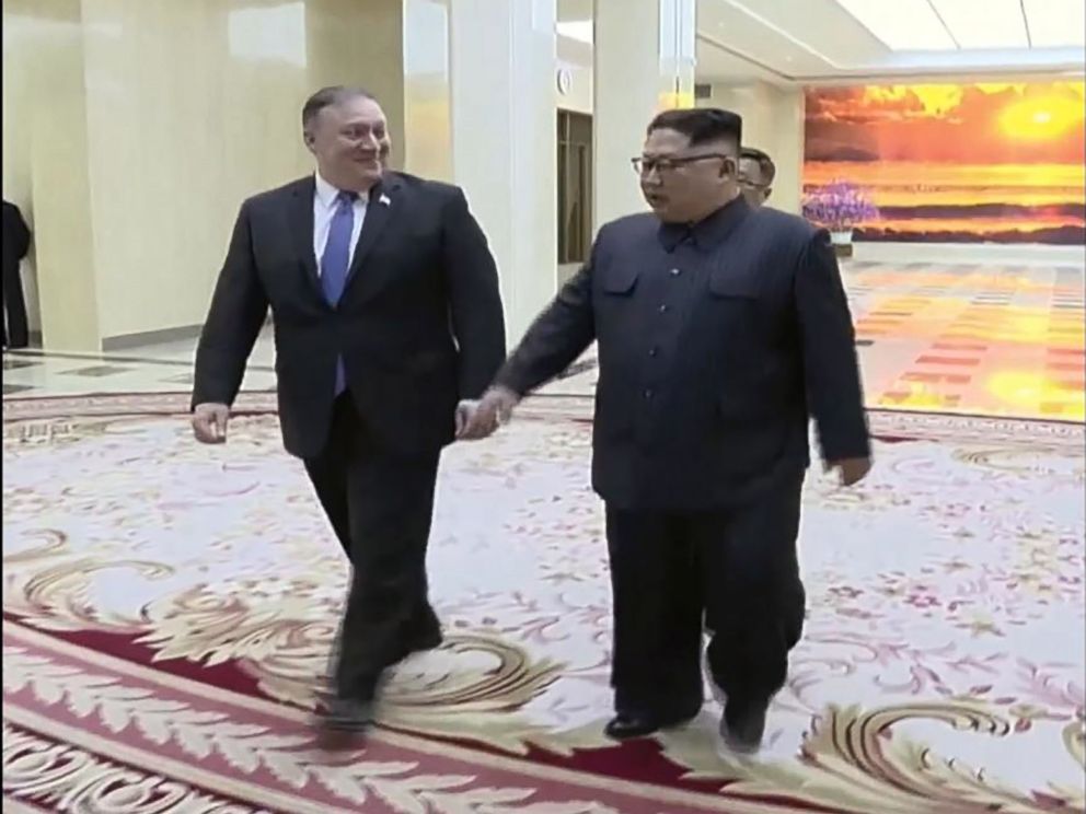 PHOTO: A scene shown on North Korean state TV of U.S. Secretary of State Mike Pompeo walking with North Korean President Kim Jong Un, May 9, 2018.