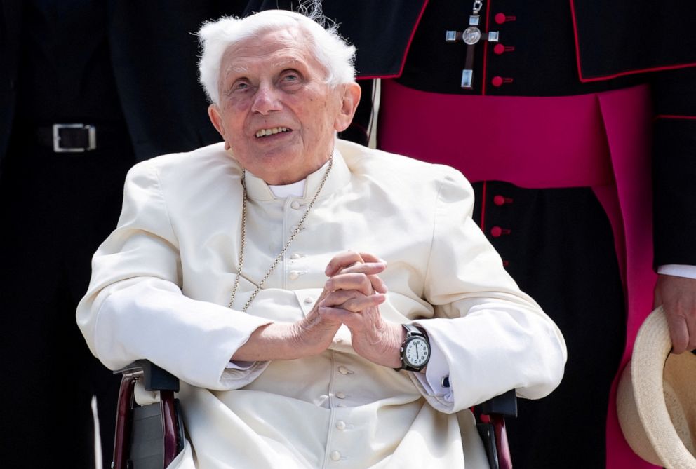 FILE PHOTO: Pope Emeritus Benedict XVI gestures at the Munich Airport before his departure to Rome, June 22, 2020. Former Pope Benedict traveled to his native Germany in 2020 to visit his ailing older brother.
