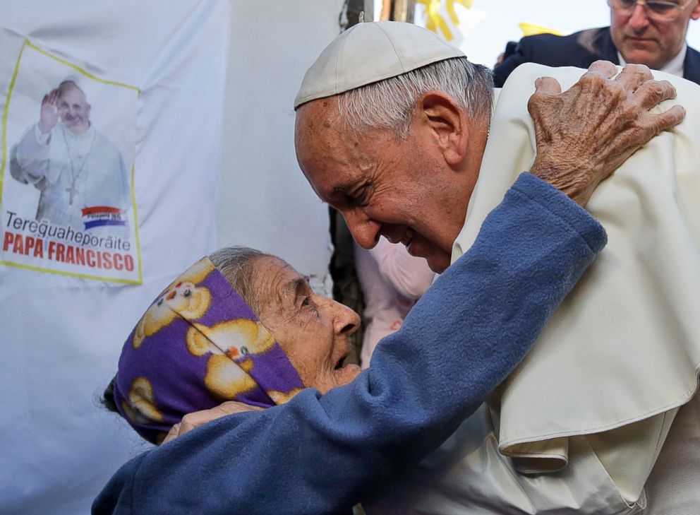 PHOTO: Pope Francis is greeted by an elderly woman during his visit to the Banado Norte neighborhood in Asuncion, Paraguay, on July 12, 2015. 