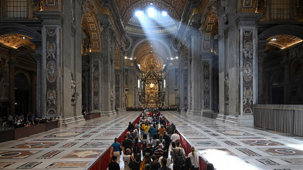 PHOTO: Members of the public line up to pay their respects to late Pope Francis as he lies in state inside Saint Peter's Basilica, Vatican City, April 24, 2025. 