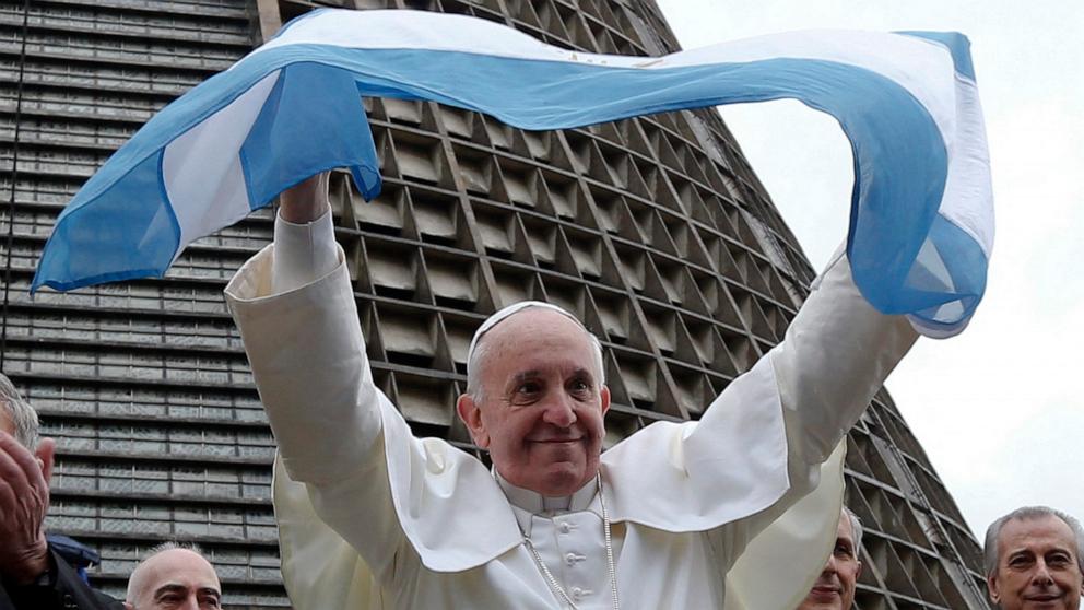 PHOTO: Pope Francis holds an Argentina flag outside the Metropolitan cathedral in Rio de Janeiro, July 25, 2013.