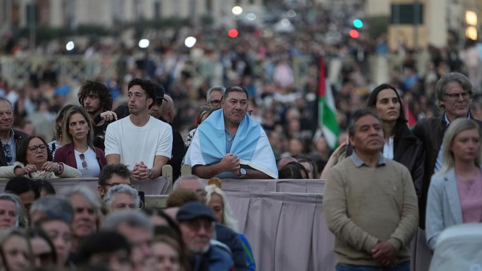 PHOTO: Faithful gather for a rosary prayer for the late Pope Francis, in St. Peter's Square at the Vatican, April 21, 2025.