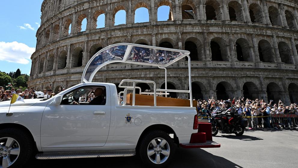 PHOTO: The coffin of late Pope Francis is seen in front of the Colosseum as it is transported from St Peter's Basilica to Santa Maria Maggiore Basilica, during the funeral ceremony in Rome, April 26, 2025.