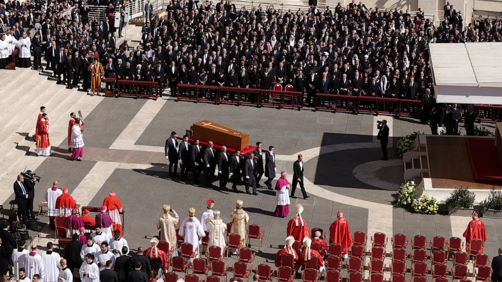 PHOTO: Pallbearers carry the coffin into St. Petere's Square during the funeral of Pope Francis, April 26, 2025 in Vatican City, Vatican.