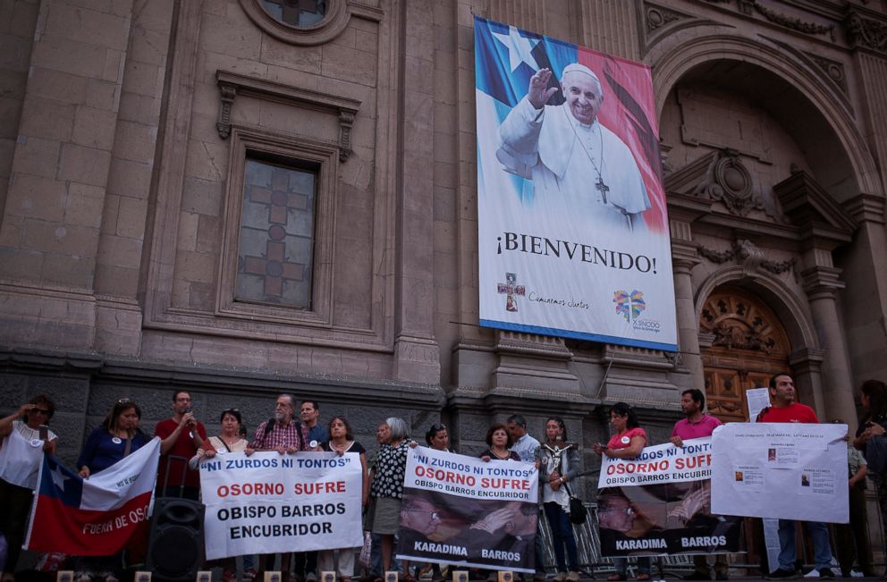 PHOTO: Members of a lay community hold banners reading "Osorno suffer" as they gather at a rally against Osorno's city bishop, Juan Barros, in front of the Cathedral of Santiago, Jan. 13, 2018 in Santiago, Chile.