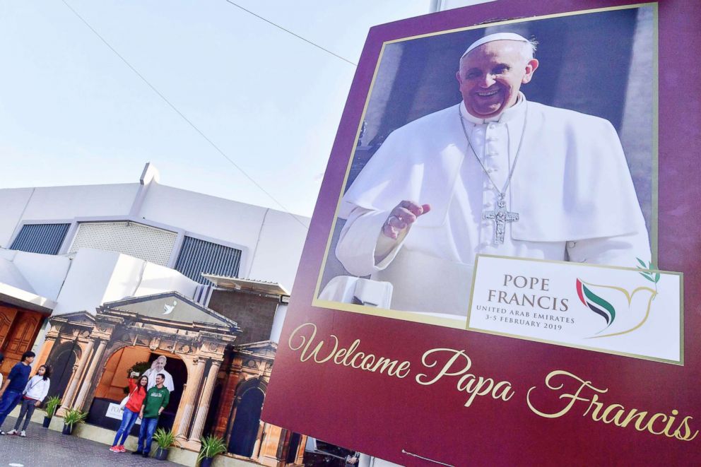 PHOTO: A man and a woman pose for a photograph with a cutout image of Pope Francis, days ahead of the papal visit to the United Arab Emirates, at St Mary's Catholic Church in Dubai, Jan. 30, 2019.
