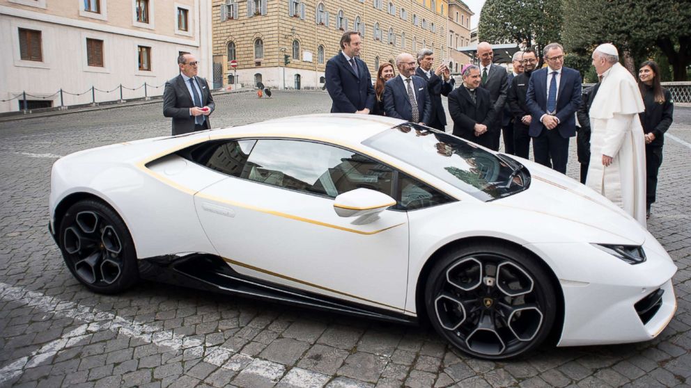 The Vatican released this photo on Nov. 15, 2017, by the Vatican press office, Osservatore Romano, showing Pope Francis receiving a Lamborghini Huracan as a gift from the Italian car company, with Lambhorgini CEO Stefano Domenicali.