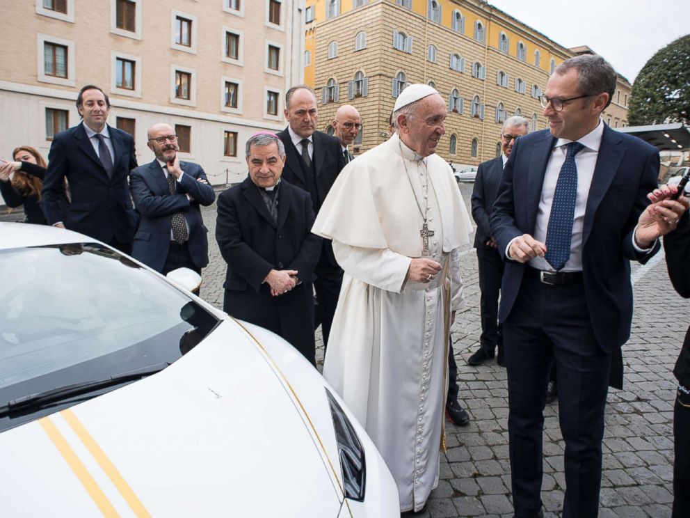 PHOTO: This handout photo taken Nov. 15, 2017, released by the Vatican press office, Osservatore Romano, shows Pope Francis speaking with Lambhorgini CEO Stefano Domenicali (R) after receiving a Lamborghini Huracan as a gift from the Italian car company.