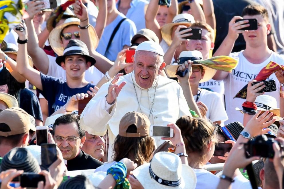 PHOTO: Pope Francis, center, waves to the faithful as he arrives for his audience to International pilgrimage of ministrants at St Peter's Square on July 31, 2018 in Vatican City.