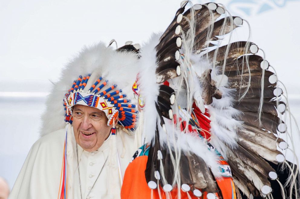 PHOTO: Pope Francis wears a traditional headdress that was gifted to him by Indigenous leaders following his apology during his visit on July 25, 2022 in Maskwacis, Canada.