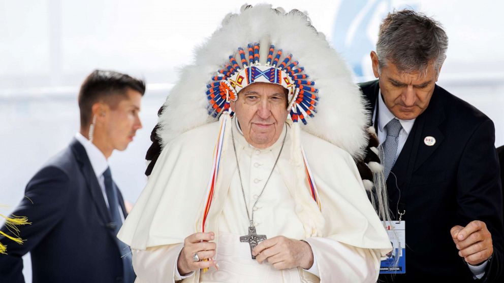 PHOTO: Pope Francis wears a traditional headdress that was gifted to him by Indigenous leaders following his apology during his visit on July 25, 2022 in Maskwacis, Canada.