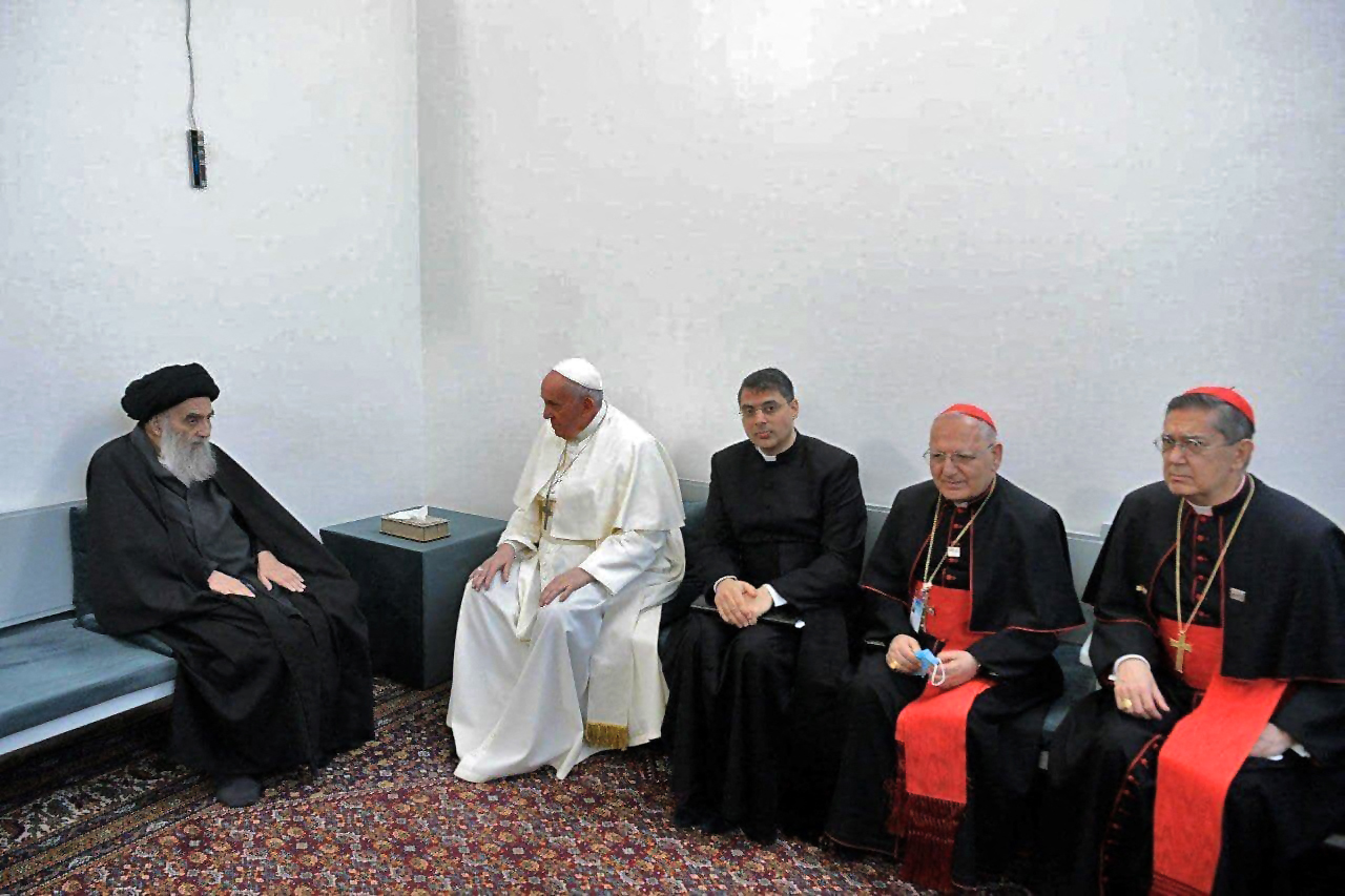 PHOTO: This handout picture released by Ayatollah Sistani's media office shows Iraq's most revered Shiite cleric, Grand Ayatollah Ali al-Sistani (L) meeting with Pope Francis and his delegation, at his home in the holy city of Najaf, on March 6, 2021. 