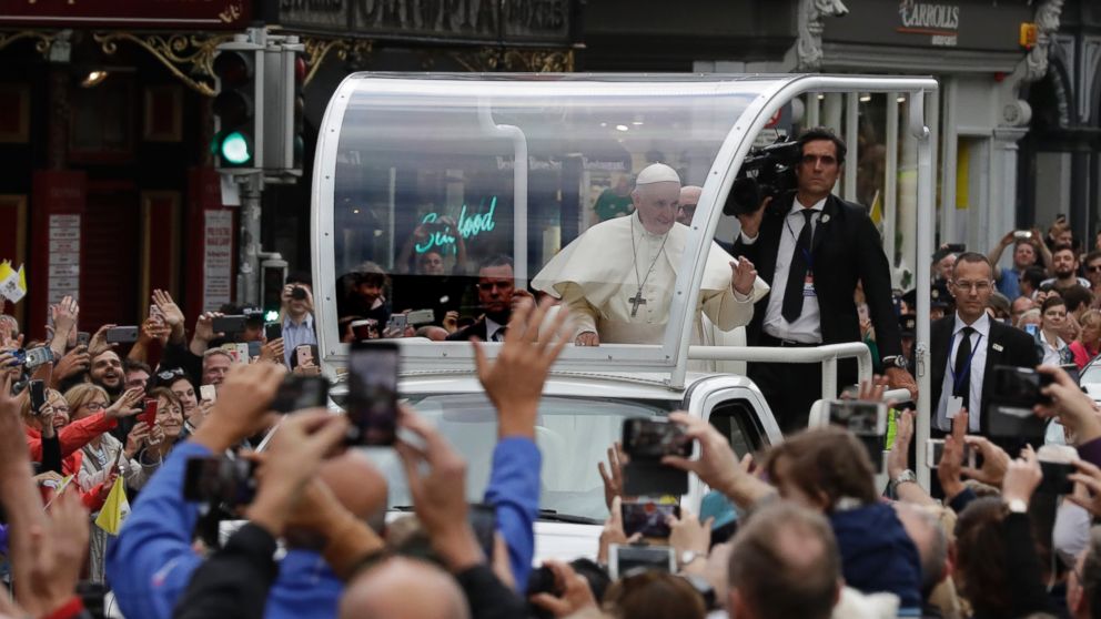 Pope Francis salutes the crawd as he leaves after visiting St Mary's Pro-Cathedral, in Dublin, Ireland, Saturday, Aug. 25, 2018. Pope Francis is on a two-day visit to Ireland.