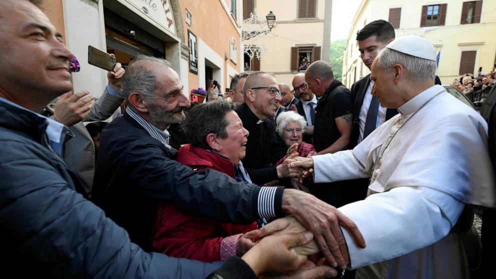 PHOTO: Pope Leo XIV greets people during a surprise visit to the Sanctuary of Our Lady of Good Counsel in Genazzano, Rome, Italy, May 10, 2025.