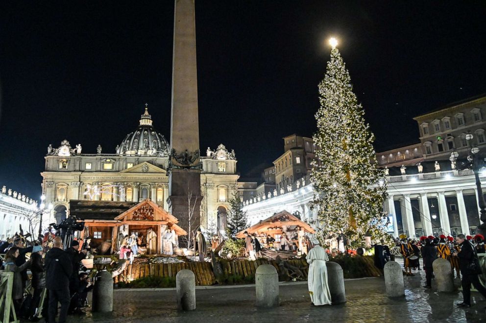 PHOTO: Pope Francis (C) walks as he visits the Nativity scene in Saint Peter's Square, following the 'Te Deum' prayer for the year 2019, in St Peter's Basilica at the Vatican on December 31, 2019. 