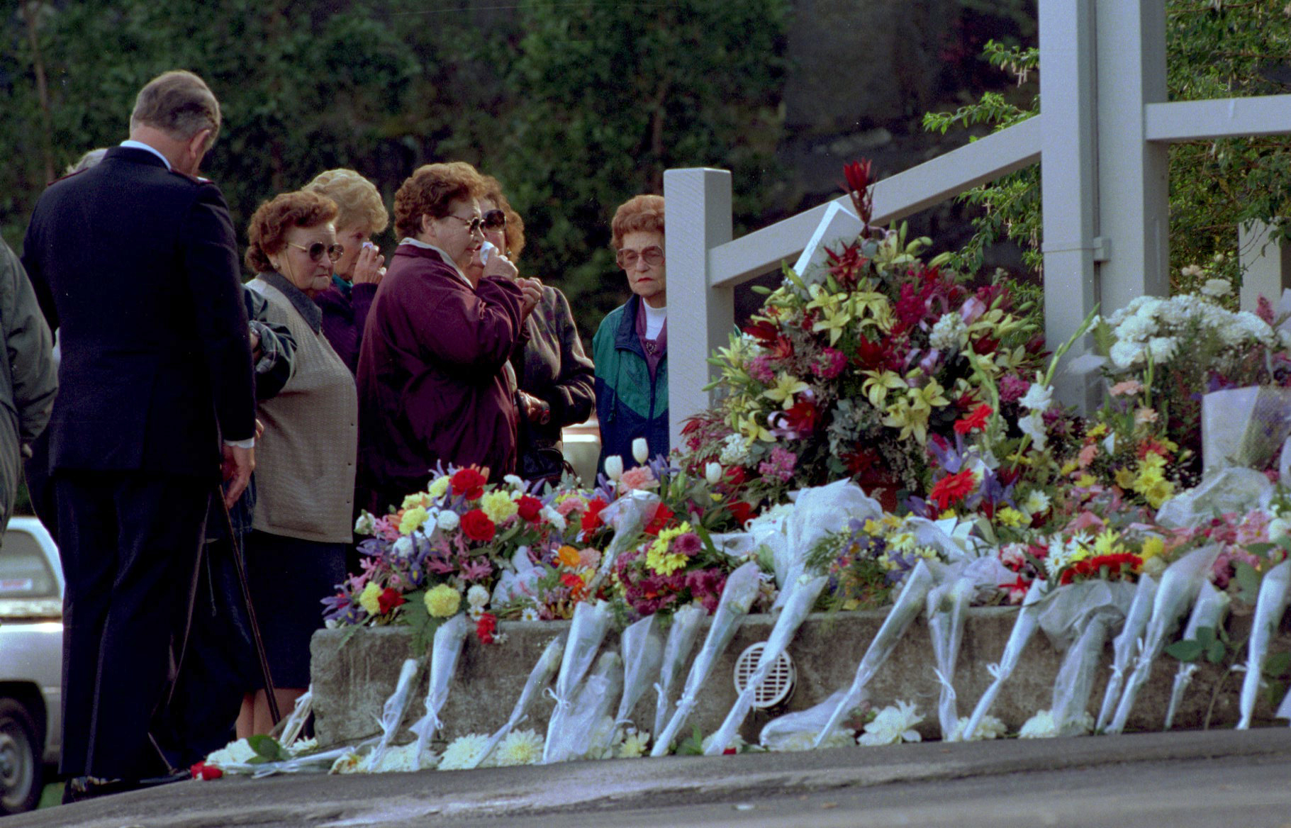 PHOTO: Mourners place flowers outside the the Broad Arrow cafe at the Port Arthur historic site as a memorial to the 35 people shot and killed by a lone gunman at the site during the Port Arthur massacre,May 5, 1996.