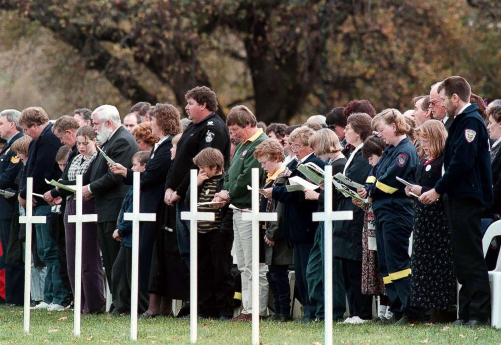 PHOTO: People pay their respects at the memorial service held at the Port Arthur historic site for the 35 victims of the Port Arthur massacre, May 19, 1996.