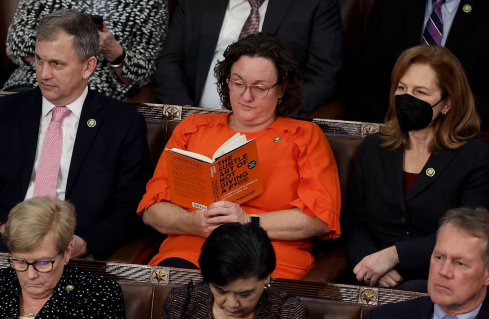 PHOTO: Rep. Katie Porter reads a book with a pointed title in the House Chamber during the fourth day of elections for Speaker of the House at the U.S. Capitol on Jan. 06, 2023 in Washington.