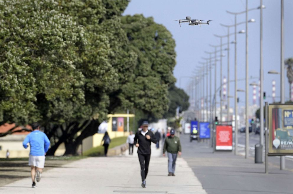 PHOTO: Drones operated by the Municipal Civil Protection of Porto, fly over the city sending messages that recommend citizens to comply with the State of Emergency and that they should remain inside their home, in Porto, Portugal, March 28, 2020.