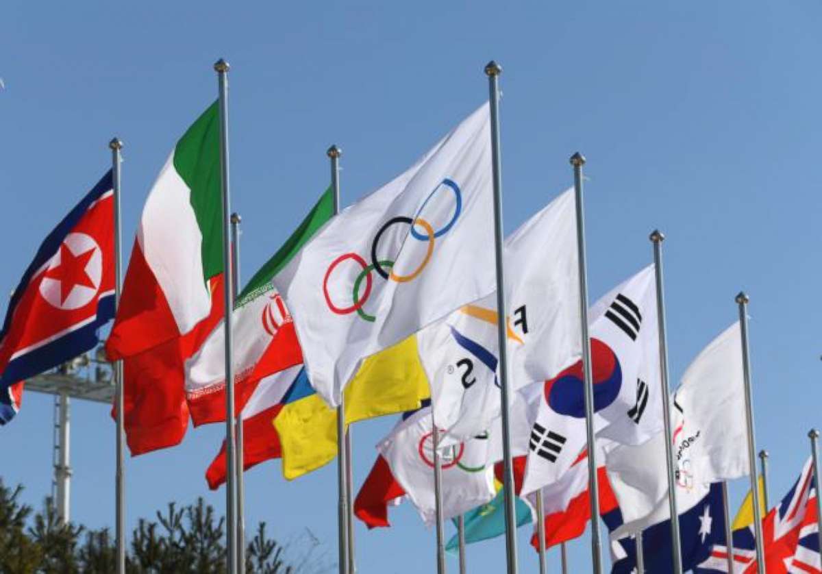 PHOTO:The Olympic flag surrounded by flags from various countries that are competing in  the Winter Olympics, wave in the wind in front of the Olympic Stadium in Pyeongchang, South Korea, Feb. 7, 2018.  