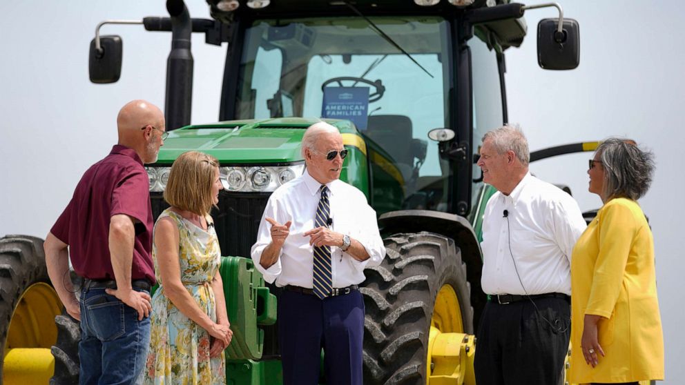PHOTO: President Joe Biden speaks as he visits O'Connor Farms with owners Gina O'Connor, second from left, and Jeff O'Connor, left, Agriculture Secretary Tom Vilsack, second from right, and Rep. Robin Kelly, D-Ill., in Kankakee, Ill., May 11, 2022.