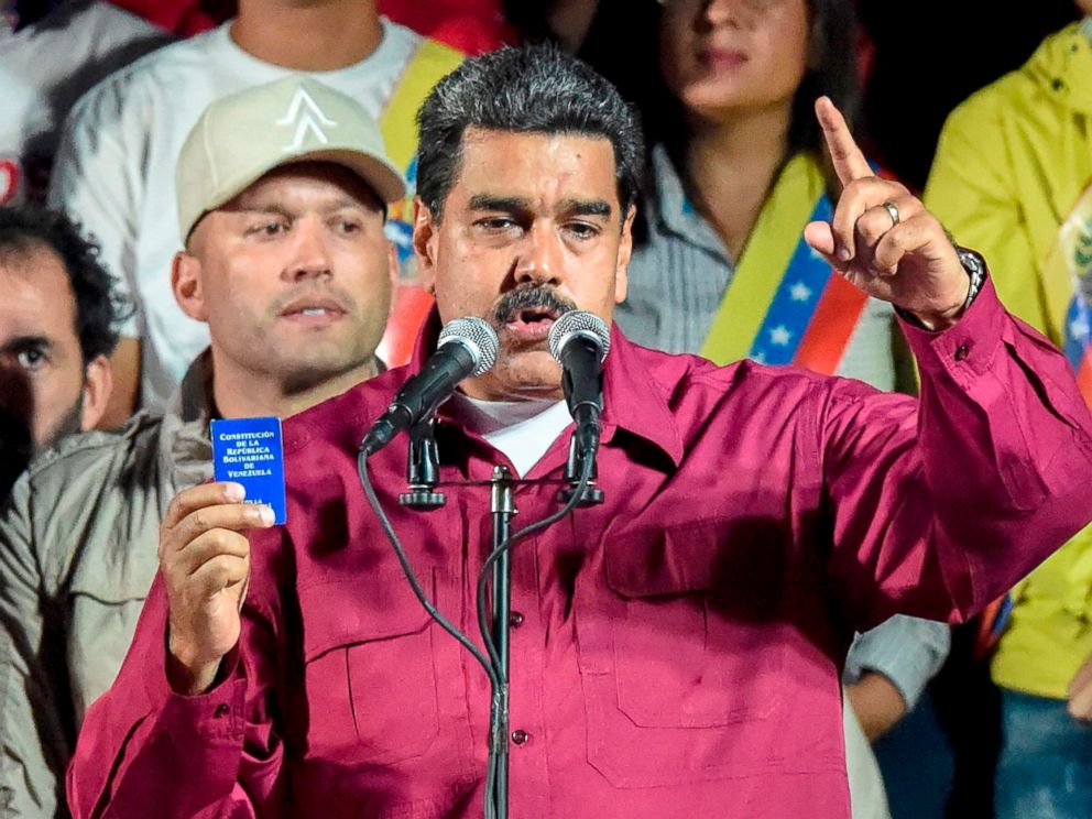 PHOTO: Venezuelan President Nicolas Maduro holds the political constitution after the National Electoral Council (CNE) announced the results of the voting on presidential election, May 20, 2018, in Caracas, Venezuela.