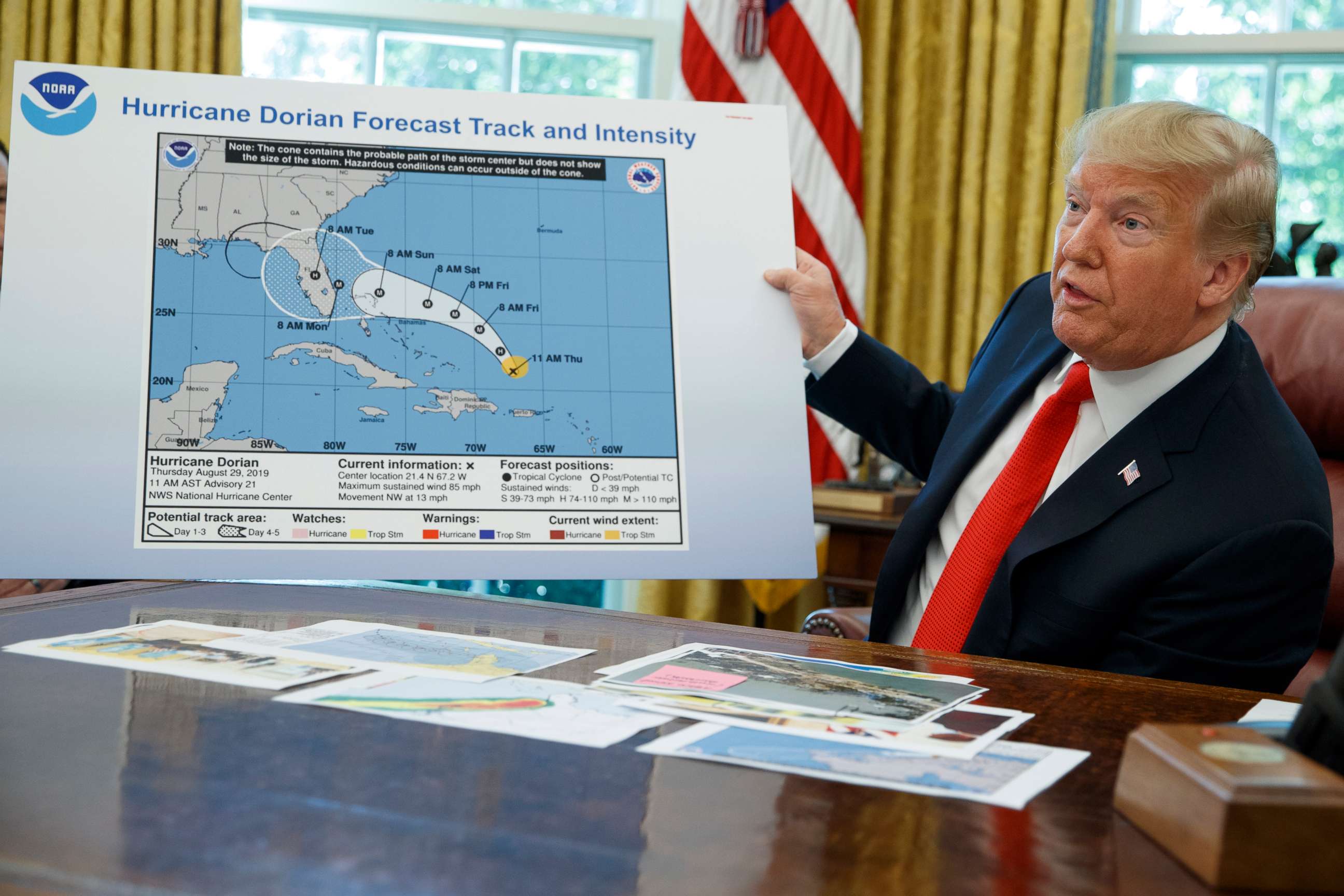 PHOTO: President Donald Trump talks with reporters after receiving a briefing on Hurricane Dorian in the Oval Office of the White House, Sept. 4, 2019, in Washington.