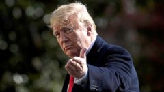 PHOTO: President Donald Trump points to the press while walking to Marine One, Nov. 29, 2018, in Washington, DC.