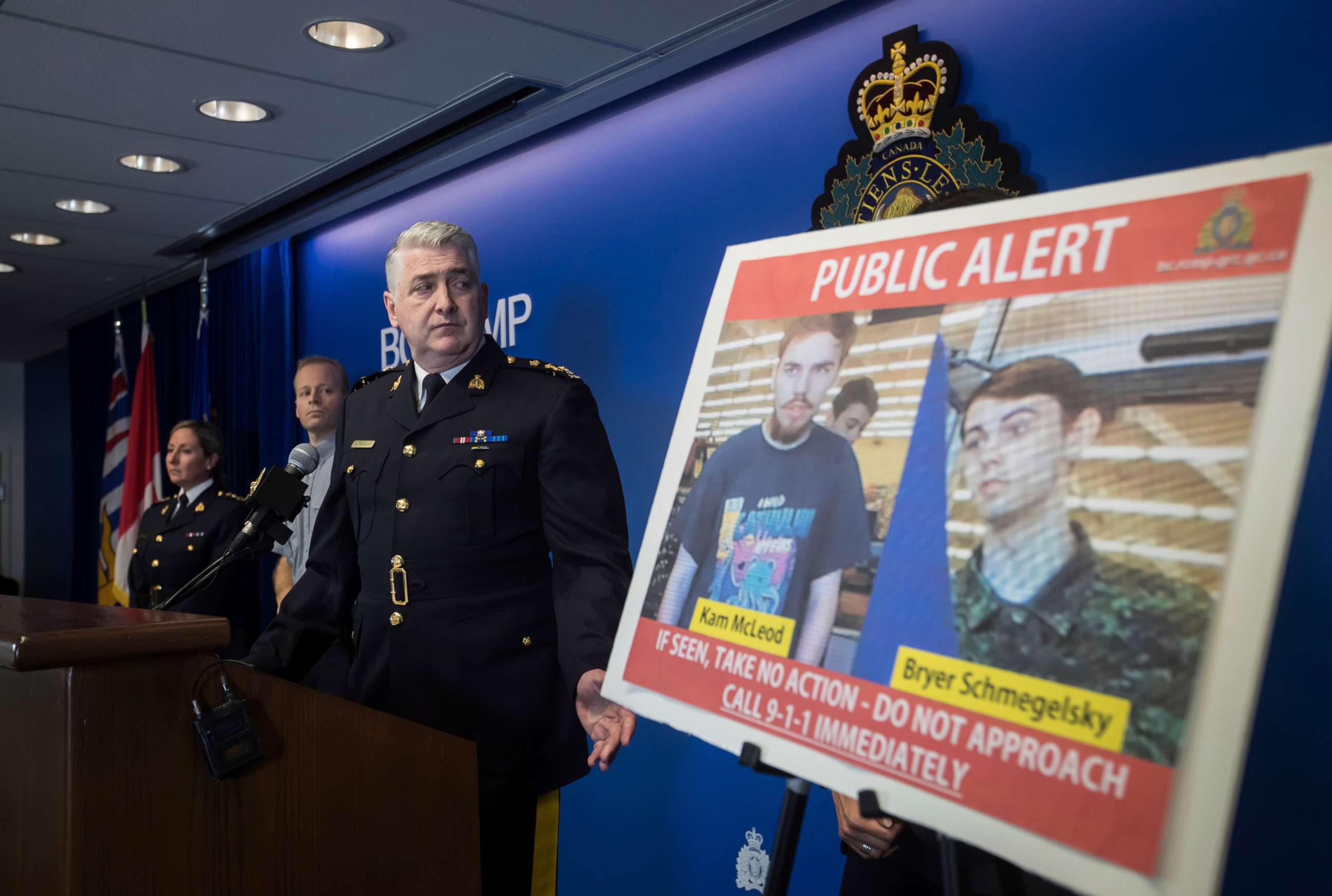 PHOTO: Security camera images recorded in Saskatchewan of Kam McLeod, 19, and Bryer Schmegelsky, 18, are displayed as Royal Canadian Mounted Police Assistant Commissioner Kevin Hackett steps away from the podium.