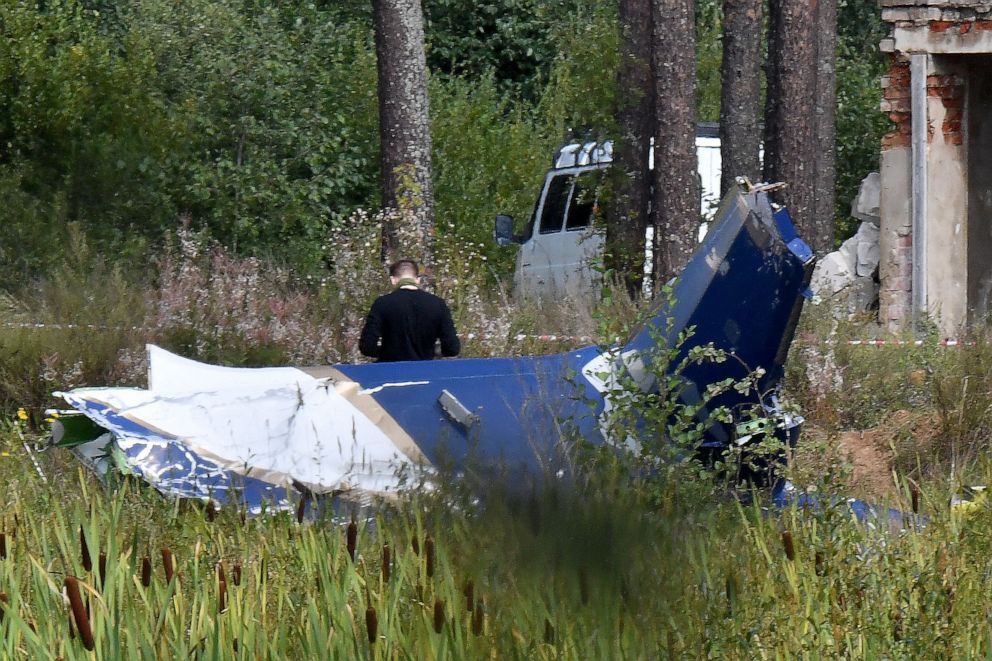 PHOTO: A law enforcement officer works at the site of a plane crash near the village of Kuzhenkino, Tver region, on August 24, 2023.