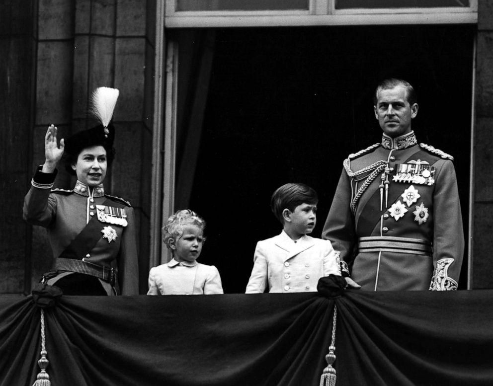 PHOTO: Queen Elizabeth II in uniform as Colonel Chief of the Grenadier Guards, with Prince Charles, Princess Anne and The Prince Philip, Duke of Edinburgh, waving from the balcony of Buckingham Palace, in London, June, 1953.