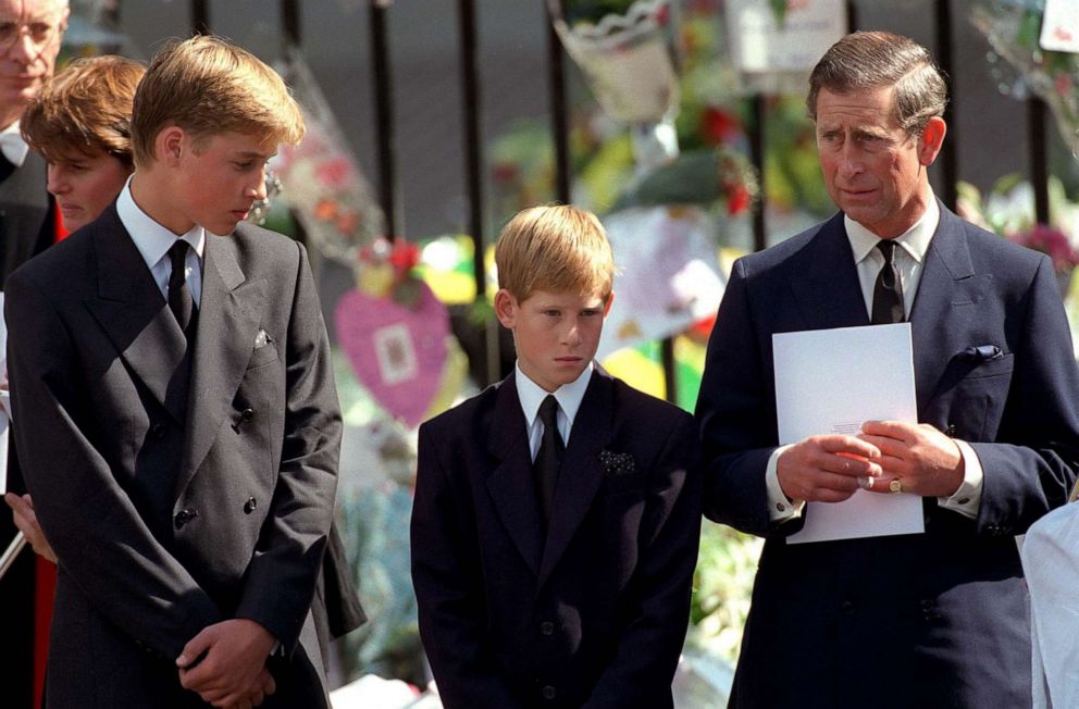 PICTURED: The Prince of Wales with Prince William and Prince Harry outside Westminster Abbey during the funeral of Diana, Princess of Wales, September 6, 1997. 