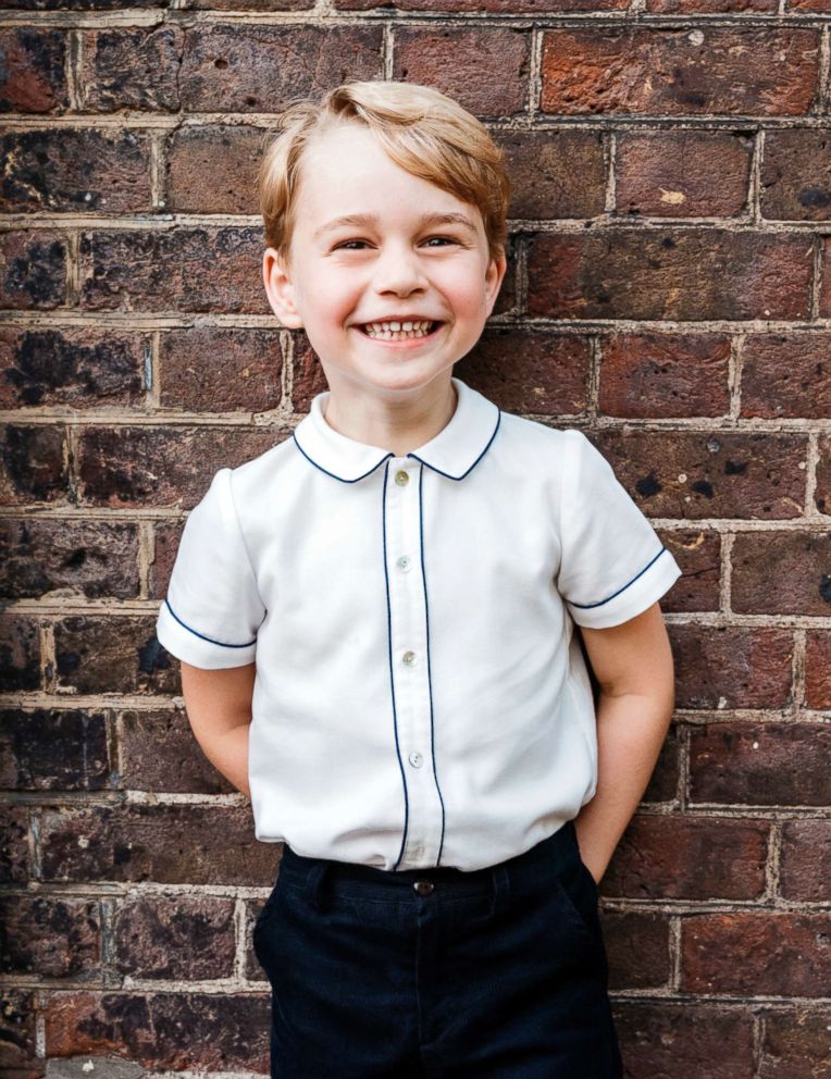 PHOTO: In this photo taken July 9, 2018, Britain's Prince George poses for a picture following the christening of his brother Prince Louis, at Clarence House in London.