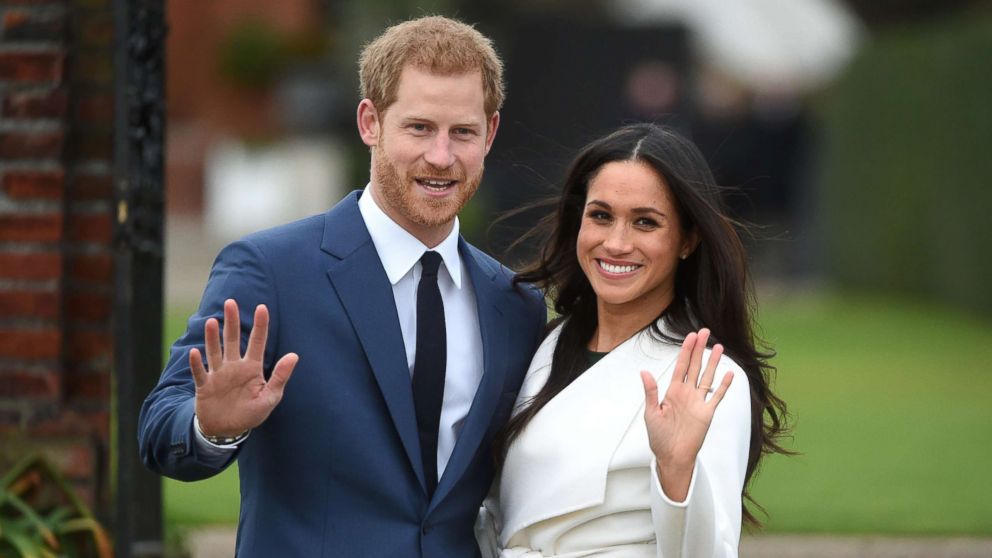 Britain's Prince Harry poses with his fiancee Meghan Markle during a photocall after announcing their engagement in the Sunken Garden at Kensington Palace in London, Nov. 27, 2017.