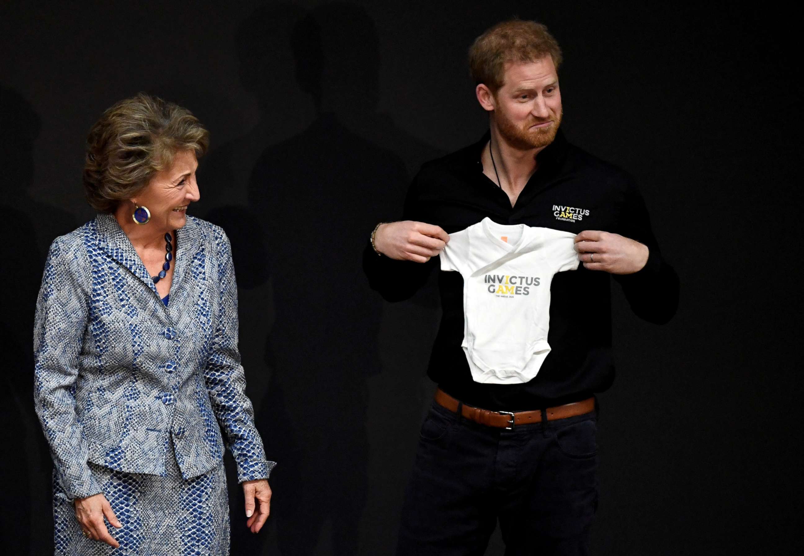 PHOTO: Britain's Prince Harry holds a onesie next to Princess Margriet of the Netherlands, during the official launch of the one year countdown to the Invictus Games The Hague 2020, in The Hague, Netherlands, May 9, 2019.