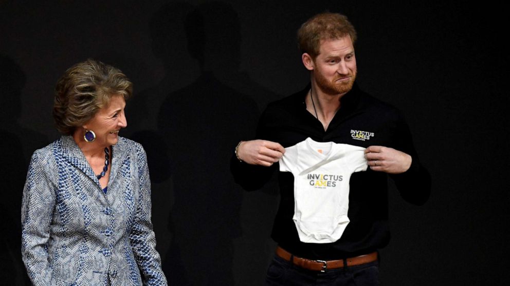 PHOTO: Britain's Prince Harry holds a onesie next to Princess Margriet of the Netherlands, during the official launch of the one year countdown to the Invictus Games The Hague 2020, in The Hague, Netherlands, May 9, 2019.