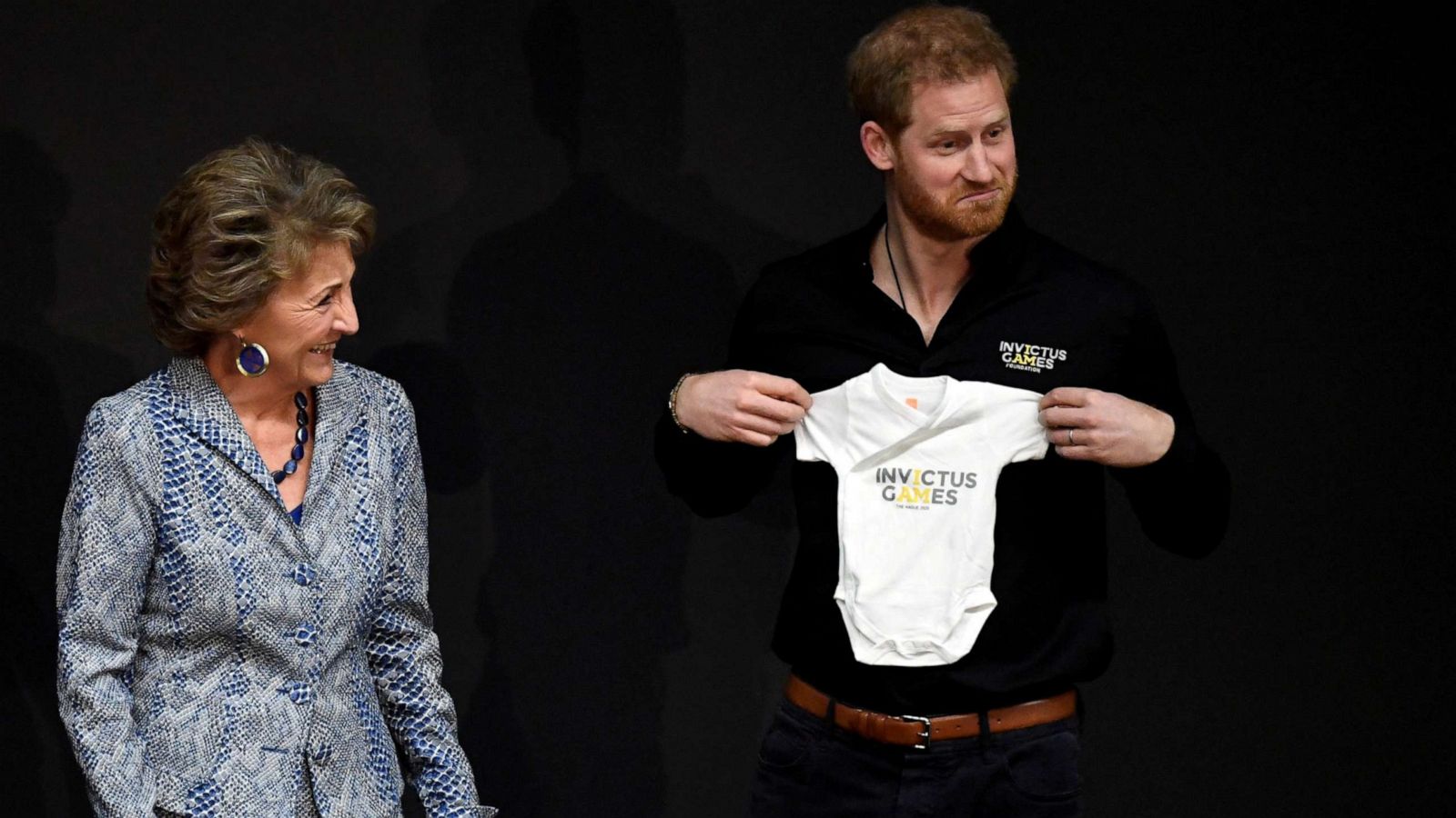 PHOTO: Britain's Prince Harry holds a onesie next to Princess Margriet of the Netherlands, during the official launch of the one year countdown to the Invictus Games The Hague 2020, in The Hague, Netherlands, May 9, 2019.