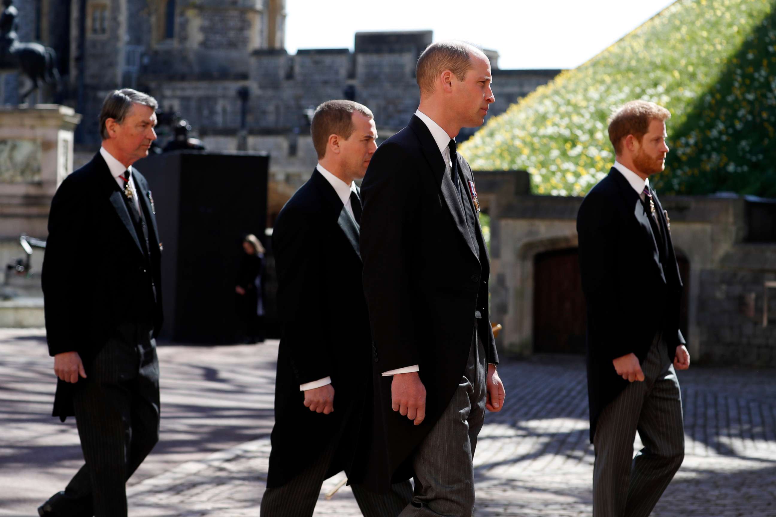 PHOTO: Vice-Admiral Sir Timothy Laurence, Peter Phillips, Prince William, Duke of Cambridge and Prince Harry, Duke of Sussex walk during the Ceremonial Procession at Windsor Castle on April 17, 2021, in Windsor, England.